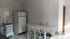 Foto 3 de Casa com 2 Quartos à venda, 81m² em Vila Nova, Porto Alegre