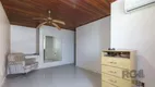 Foto 13 de Casa com 4 Quartos à venda, 236m² em Santa Fé, Porto Alegre