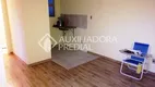 Foto 2 de Apartamento com 2 Quartos à venda, 39m² em Vila Nova, Porto Alegre