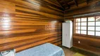 Foto 25 de Casa com 4 Quartos à venda, 223m² em Vila Nova, Porto Alegre