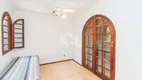 Foto 4 de Casa com 4 Quartos à venda, 279m² em Vila Nova, Porto Alegre