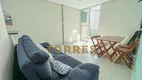 Foto 2 de Apartamento com 2 Quartos à venda, 60m² em Praia das Pitangueiras, Guarujá