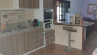 Foto 9 de Casa com 4 Quartos à venda, 301m² em Vila Nova, Porto Alegre