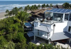 Foto 1 de Casa de Condomínio com 5 Quartos para venda ou aluguel, 300m² em Loteamento Costa do Sol, Bertioga