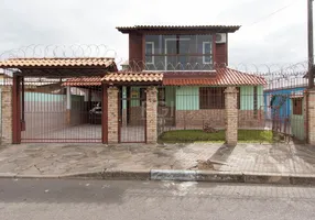 Foto 1 de Casa com 4 Quartos à venda, 224m² em Vila Nova, Porto Alegre
