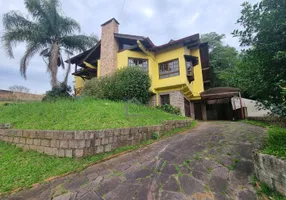 Foto 1 de Casa de Condomínio com 5 Quartos para venda ou aluguel, 375m² em Centro, Viamão