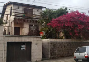 Foto 1 de Casa de Condomínio com 5 Quartos à venda, 100m² em Santo Antônio, Porto Alegre