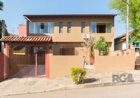 Foto 1 de Casa com 4 Quartos à venda, 264m² em Cavalhada, Porto Alegre