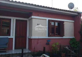 Foto 1 de Casa de Condomínio com 2 Quartos à venda, 69m² em São Tomé, Viamão