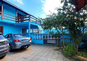 Foto 1 de Casa com 4 Quartos à venda, 140m² em Vila Nova, Porto Alegre