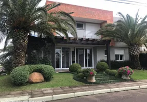 Foto 1 de Casa de Condomínio com 4 Quartos à venda, 210m² em Centro, Capão da Canoa