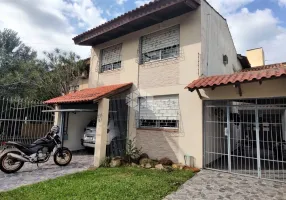 Foto 1 de Casa com 4 Quartos à venda, 173m² em Santa Fé, Porto Alegre