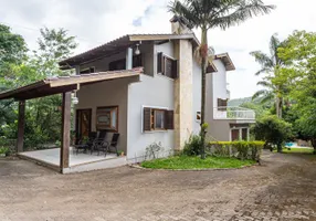 Foto 1 de Casa com 5 Quartos para alugar, 321m² em Vila Nova, Porto Alegre