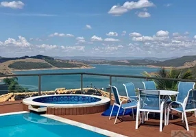 Foto 1 de Casa de Condomínio com 6 Quartos à venda, 450m² em Escarpas do Lago, Capitólio