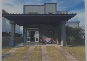 Foto 1 de Casa de Condomínio com 4 Quartos à venda, 450m² em Atlantida Sul, Osório