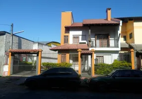 Foto 1 de Casa com 6 Quartos à venda, 399m² em Santo Antônio, Porto Alegre