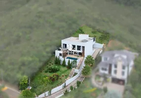 Foto 1 de Casa de Condomínio com 4 Quartos à venda, 478m² em Vila  Alpina, Nova Lima