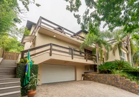 Foto 1 de Casa com 6 Quartos para alugar, 400m² em Cavalhada, Porto Alegre