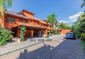 Foto 1 de Casa de Condomínio com 4 Quartos para venda ou aluguel, 650m² em Três Figueiras, Porto Alegre