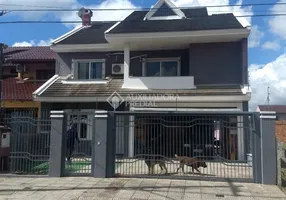 Foto 1 de Casa com 4 Quartos à venda, 286m² em Santa Fé, Porto Alegre