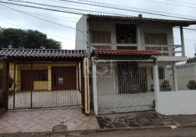 Foto 1 de Casa com 4 Quartos à venda, 179m² em Campo Novo, Porto Alegre