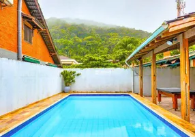 Foto 1 de Casa de Condomínio com 3 Quartos à venda, 180m² em Balneário Praia do Perequê , Guarujá