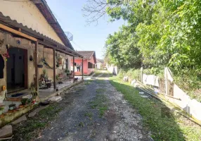 Foto 1 de Casa com 6 Quartos à venda, 392m² em Vila Nova, Porto Alegre