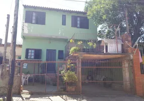 Foto 1 de Casa com 4 Quartos à venda, 91m² em Tarumã, Viamão