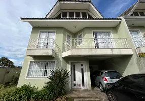 Foto 1 de Sobrado com 3 Quartos à venda, 185m² em Bacacheri, Curitiba