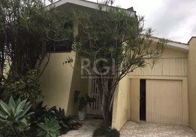 Foto 1 de Casa com 3 Quartos à venda, 608m² em Pedra Redonda, Porto Alegre