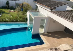 Foto 1 de Casa de Condomínio com 4 Quartos para venda ou aluguel, 1100m² em Barra da Tijuca, Rio de Janeiro