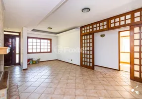 Foto 1 de Casa com 4 Quartos à venda, 228m² em Cavalhada, Porto Alegre