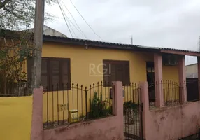 Foto 1 de Casa com 4 Quartos à venda, 299m² em Vila Nova, Porto Alegre