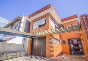 Foto 1 de Casa com 4 Quartos à venda, 214m² em Auxiliadora, Porto Alegre