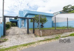 Foto 1 de Casa com 5 Quartos à venda, 312m² em Vila Nova, Porto Alegre