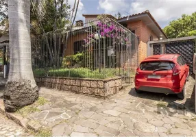 Foto 1 de Casa com 4 Quartos à venda, 250m² em Três Figueiras, Porto Alegre