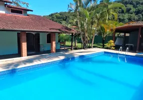 Foto 1 de Casa de Condomínio com 7 Quartos à venda, 245m² em Massaguaçu, Caraguatatuba