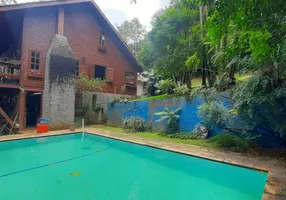 Foto 1 de Casa de Condomínio com 4 Quartos à venda, 280m² em Cumbari, Mairiporã