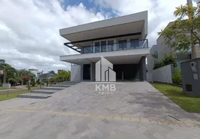 Foto 1 de Casa de Condomínio com 5 Quartos para venda ou aluguel, 520m² em Alphaville, Gravataí