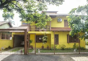 Foto 1 de Casa com 4 Quartos à venda, 249m² em Santa Fé, Porto Alegre