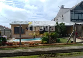 Foto 1 de Casa com 6 Quartos à venda, 372m² em Zona Nova, Tramandaí