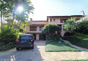 Foto 1 de Casa com 5 Quartos à venda, 420m² em Cavalhada, Porto Alegre