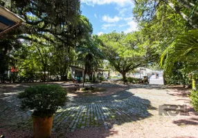 Foto 1 de Casa com 7 Quartos à venda, 602m² em Pedra Redonda, Porto Alegre