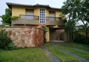 Foto 1 de Sobrado com 4 Quartos à venda, 550m² em Balneário Praia do Pernambuco, Guarujá