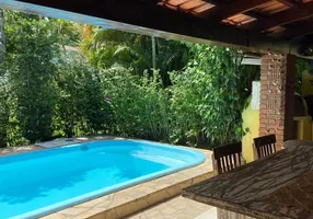 Foto 1 de Casa de Condomínio com 4 Quartos à venda, 158m² em Guaeca, São Sebastião