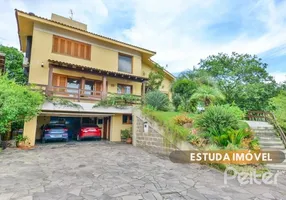 Foto 1 de Casa de Condomínio com 4 Quartos à venda, 389m² em Vila Nova, Porto Alegre
