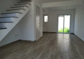 Foto 1 de Casa com 2 Quartos à venda, 83m² em Vila Nova, Porto Alegre