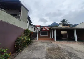 Foto 1 de Casa com 4 Quartos à venda, 180m² em Cidade Jardim, Caraguatatuba