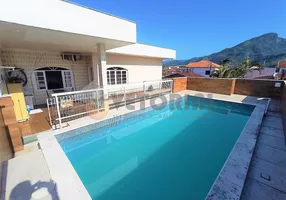 Foto 1 de Sobrado com 6 Quartos à venda, 394m² em Indaiá, Caraguatatuba