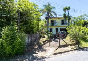 Foto 1 de Casa com 4 Quartos à venda, 141m² em Vila Nova, Porto Alegre